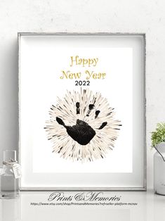 a happy new year card with a hand print on it