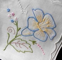 embroidered flowers on white linen with beading