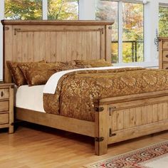 a wooden bed sitting on top of a hard wood floor