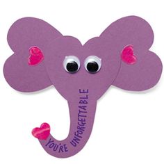 an elephant made out of purple paper with eyes and ears on it's head