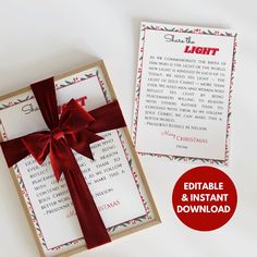 a christmas card with a red bow on it next to an envelope that says light