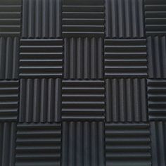 an image of black tiles that look like they have been made out of plastic material