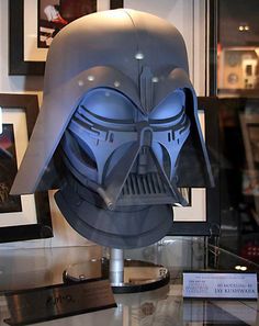 a star wars helmet is on display in a glass case