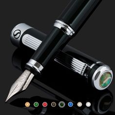 a fountain pen with different colored inks and its cap open on a black surface