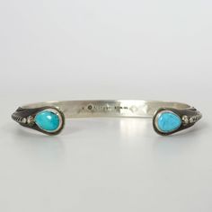 Sterling Silver Cuff Bracelet with Hand-Stamped Designs and set with Natural Turquoise on the Cuff Terminals. .25” Cuff Width6” Inside Measurement, plus 1.25” opening(7.25" Total Circumference - Large) Turquoise Stamped Cuff Bracelet Bangle, Turquoise Stamped Cuff Bangle Bracelet, Zuni Jewelry, Concho Belt, Navajo Jewelry, Southwestern Jewelry, Turquoise Cuff, Sterling Silver Cuff Bracelet, Sterling Silver Cuff