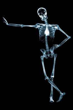 an x - ray image of a skeleton holding his arm out and pointing at something