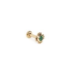 a pair of gold earrings with green stones on the top and an oval stone in the middle