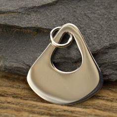 Teardrop Pendant - Sterling Silver Abstract Teardrop Pendant - Earring Ideas, Dangling Charms, Abstract Jewelry, Jewelry Supplies, Findings Sterling Silver Organic Teardrop Dangle. A modern take on a classic teardrop shape. Add beautiful curves and shape to your jewelry with this piece. This dangle would make for a great pair of earrings either on their own, or paired with links and other dangles. Or, try lining multiple pieces next to each other for an interesting statement necklace. The possib Abstract Jewelry, Tiny Charm, Pendant Earring, Quartz Crystal Necklace, Earring Ideas, Dragon Pendant, Teardrop Pendant, Beautiful Curves, Dangle Charms