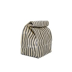 a striped bag sitting on top of a white surface