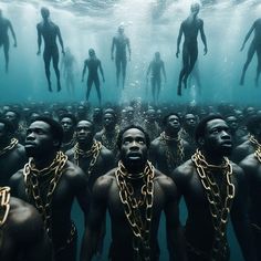 a group of men standing in the water surrounded by chains