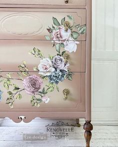 a pink dresser with flowers painted on it