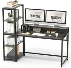 two computer monitors sitting on top of a wooden desk next to books and other items