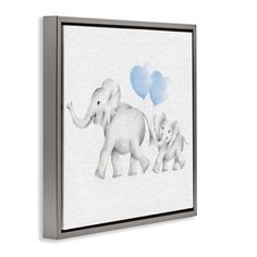 an elephant family with two blue balloons floating in the air on a white background canvas wall art print