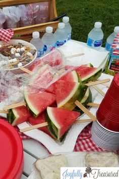 watermelon slices and juice on a tray with flowers