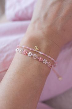 Pink Friendship Bracelets For Spring, Cute Beaded Bracelets For Friendship, Trendy Flower Bracelets For Friendship, Cute Pink Beaded Bracelet With Flower Charm, Cute Flower-shaped Beaded Bracelets For Gifts, Trendy Pink Beaded Bracelets For Spring, Cute Flower Shaped Beaded Bracelets For Gift, Pink Trendy Beaded Bracelets For Spring, Dainty Spring Beaded Bracelets