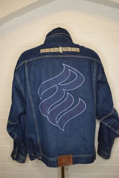 "Vintage Rocawear Jay-Z Embroidered Jean Denim Jacket 90's XXL Measured Size   Under Arm to Under Arm 28\" Top to Bottom 30\" Shoulder Seam to Cuff 24\" Excellent condition. Minimal fading   We sell 'As Is\" final sale. We extensively look over every garment that we post on Etsy. However, things do get missed. While we want our clients to love each piece as much as we do some things won't be up to some standards. We ask that you keep in mind that these are vintage pieces that hold an individual Embroidered Denim Jacket For Winter Streetwear, Embroidered Denim Outerwear For Streetwear, Fitted Embroidered Denim Jacket For Streetwear, 90s Oversized Denim Jacket For Streetwear, Oversized 90s Denim Jacket For Streetwear, 90s Dark Wash Outerwear For Streetwear, 90s Long Sleeve Denim Jacket For Streetwear, Fitted Retro Denim Jacket For Streetwear, Embroidered Jeans