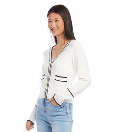 This versatile cardigan effortlessly blends both comfort and elegance with its contrasting trim and convenient patch pockets. Ideal for a casual day out or a polished office look, this essential layering piece adds a touch of sophistication to any ensemble. Color - Black and off white. V-neckline. Long sleeves. Contrast trim. Ribbed cuffs and hem detail. Front patch pockets. Fabric - 50% Viscose. 25% Polyester. 25% Nylon. Care - Dry clean. Petite Sweaters, Cardigan Design, Button Front Cardigan, Karen Kane, Of Outfits, Style Cardigan, Ribbed Knit Sweater, Cardigan Fashion, Contrast Trim