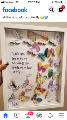 someone is holding up a shadow box with butterflies on it that reads, thank you for opening our wings and teaching us how to fly