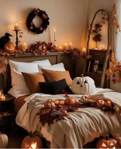 a bedroom decorated for halloween with pumpkins and candles