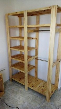 an unfinished shelving unit in the corner of a room