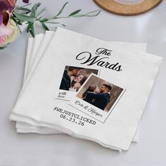 two personalized wedding napkins on top of a table with flowers in the background