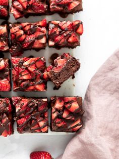 chocolate brownies topped with strawberries and drizzled with chocolate