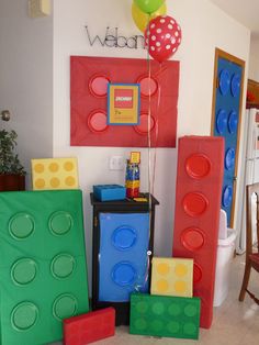 a room filled with lego blocks and balloons