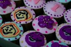 cupcakes decorated with pink, purple and yellow icing