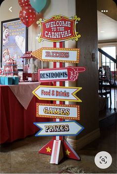 there are many signs on the table at this carnival themed birthday party that say welcome to the carnival