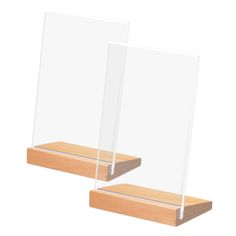 two clear acrylic displays on wooden bases