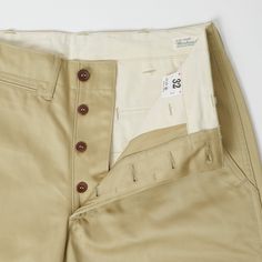 Taking their influence from American Military issue shorts of the 1940s, the 1204 short is cut in a standard shape and retains all the classic detailing of a traditional Officer’s trouser. A 100% cotton chino has been used for the outer of this design, whilst high-grade cotton drill has been used for interior facings. A button fly is matched with simple, traditional military style buttons, and the waistband has a set of belt loops for added support. Two side entry front pockets help to retain th American Military, Cotton Chinos, Military Style, Clothing Co, Chino Shorts, Military Fashion, Well Dressed, Smart Casual, Summer Looks