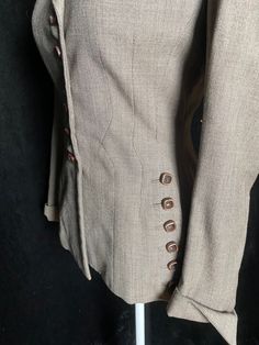 "Late 40's/early 50's gray brown Dan Millstein super pleated blazer with rows of buttons. Discolored red lining, interior collar staining, and one smaller stain on a cuff. All shown in photos Women's small/medium 36\" bust 27\" waist 26\" shoulder to hem 14.5\" back shoulders" Elegant Brown Blazer With Button Cuffs, Fitted Brown Double-breasted Blazer, Fitted Brown Blazer With Single Button, Fitted Brown Single Button Blazer, Fitted Brown Single-button Blazer, Fitted Brown Blazer With Hidden Button Closure, Fitted Button-up Sport Coat With Button Cuffs, Fitted Brown Sport Coat With Buttons, Formal Brown Blazer With Buttons