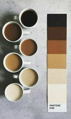 four cups of coffee sit in front of a pantone color swatch with five different colors