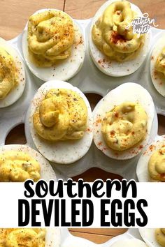 several deviled eggs are arranged on a tray with the words southern deviled eggs