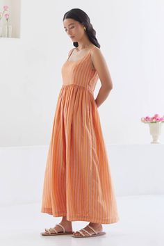 Orange, pink sleeveless dress with stripe woven motifs and gathered waist. - Aza Fashions Striped Maxi Dress For Daywear, Sleeveless Pleated Bodice Beach Dress, Sleeveless Cotton Dresses With Pleated Bodice, Sleeveless Vertical Stripes Maxi Dress, Sleeveless Striped Beach Dress, Sleeveless Cotton Maxi Dress With Gathered Waist, Sleeveless Vertical Striped Summer Dresses, Sleeveless Midi Dress With Vertical Stripes For Spring, Cotton Maxi Dress With Pleated Bodice