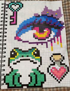 a notebook with an image of a woman's face in pixel art on it