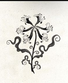 a black and white drawing of a cross with swirls on it's side