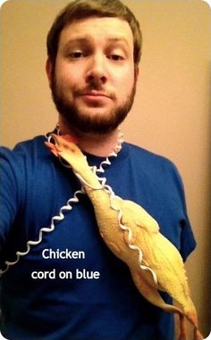 a man wearing a blue shirt and holding a banana peel in his hand with the caption chicken cord on blue