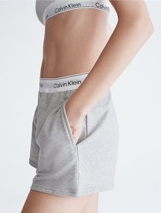 Our most iconic program, rooted in our past and reimagined for our future. These Calvin Klein modern cotton lounge sleep shorts are made from soft cotton and recycled polyester jersey for a partly sustainable design. Finished with a classic logo waistband, side pockets and seaming details.  Material: 58% Cotton, 39% Recycled Polyester, 3% Elastane. Calvin Klein Pjs, Calvin Klein Shorts Woman, Calvin Klien, Ck Calvin Klein, Pilates Princess, Calvin Klein Shorts, Future Wardrobe, Fall Clothing, Sleep Wear