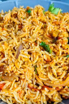 a plate full of rice and vegetables with broccoli