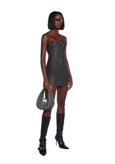 This fully lined mini dress has a matte vegan leather construction, structured boning on the front and back, side slits, a lace-up design at the neckline, adjustable shoulder straps, and a back zipper closure. Black Mini Dress With Adjustable Straps For Club, Evening Mini Dress With Lace-up Back, Mini Dress With Adjustable Straps For Night Out, Gothic Corset Dress With Straps For Night Out, Gothic Spaghetti Strap Mini Dress For Night Out, Gothic Mini Dress With Spaghetti Straps For Night Out, Mini Dress With Lace-up Back For Night Out, Club Mini Dress With Corset Back, Mini Bodycon Dress With Adjustable Straps For Club