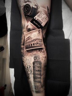 a man's leg with a tattoo on it and an image of the leaning tower