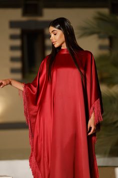 Featuring: High-neck Tie-wrap back closure. Silk fringe Satin fabric Butterfly sleeve caftan Luxurious fringe sleeves and hem Free size Fabric:Fringes - Silk.Bodice Fabric - Satin.Color: BurgundyBrand: Unmatched BYU Size: Free size. (Fits between size 2 US up to size 20 US).Length: 47 inches.This caftan is available in multiple colors Elegant Long Sleeve Kaftan With Tassels, Evening Kaftan With Tassels, Fringe Sleeves, Fabric Butterfly, Black Tie Gala, Statement Accessories, Butterfly Sleeve, Tie Wrap, Curvy Plus Size