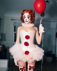 a woman dressed up as a clown holding a red balloon and wearing white tights