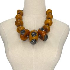 Reconstituted Amber Statement Necklace. Embellished wits Swarovski Crystals. Necklace Earring Set ONE OF A KIND DESIGNMETAL: Stainless SteelAPPROX SIZE: 20" Adjustable Length. Earrings 2"CLOSURE: Lobster Claw Clasp Amber Jewelry With Large Beads, Amber Round Beaded Jewelry, Amber Jewelry With Large Round Beads, Round Amber Jewelry With Large Beads, Luxury Handmade Orange Jewelry, Amber Beaded Jewelry For Formal Occasions, Elegant Amber Jewelry With Large Beads, Formal Amber Beaded Jewelry, Orange Round Jewelry With Large Beads