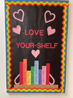 a bulletin board that says love your shelf with books on it and hearts in the middle