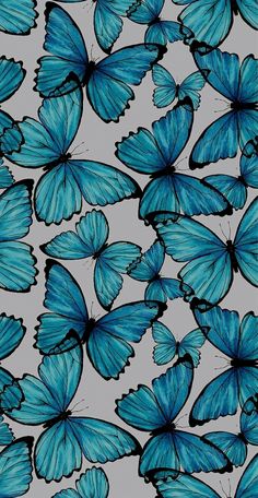 many blue butterflies flying in the sky with their wings spread out to look like they're