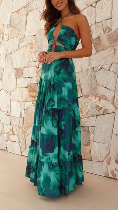 Make a statement with this bold green halter maxi dress. Featuring a stunning center-front cut-out, a tiered skirt, and an elegant halter neck, this dress is designed to turn heads. Optical Illusion Dress, Tropical Dress, Wedding Attire Guest, Halter Maxi, Halter Maxi Dresses, Tiered Skirt, Invisible Zipper, Guest Dresses, Dress Codes