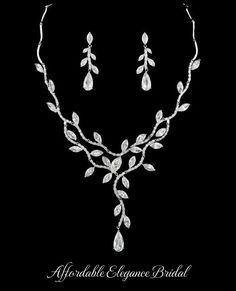 Stunning CZ Vine Bridal Jewelry Set You'll love the dazzling sparkle of our glamorous new cz bridal jewelry set. Add glamour to your wedding day look with this elegant necklace and earrings jewelry set. This silver or gold plated jewelry set will be a memorable addition to your wedding ensemble. It features AAA quality teardrop and marquise cz crystals in a dramatic vine design. The beautiful matching drop earrings are for pierced ears. Size: Necklace - about 16.5" Long. Pierced Earrings are about 1.5" long. Color: Silver or Gold. Style: nemr4225. Please allow 1 week for delivery. Shipping Policy . Return Policy. Prom Hair Accessories, Bridal Jewelry Set, Wedding Jewellery Collection, Dress Indian, Vine Design, Punk Jewelry, Elegant Necklace, Pretty Jewelry, Earring Jewelry