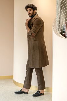 Brown overcoat with double layered notch lapel and patch pockets. 
Component: 1
Pattern: Plain
Neckline: Notched Lapel
Sleeve Type: Full Sleeves
Fabric: Cotton Linen
Color: Brown
Other Details: 
Note: Inner shirt and pant worn by the model is not for sale
Occasion: Party - Aza Fashions Jatin Malik, Brown Overcoat, Overcoat Men, Linen Color, Blue Ombre, Full Sleeves, Custom Tailoring, Shirt And Pants, Pant Set